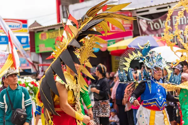 stock image East Kalimantan, Indonesia August 24, 2023 : Carnival which is enlivened with various performances ranging from reog, wayang, cartoon characters, heroes, ghosts, dances, traditional/tribal clothing and others in Tenggarong Seberang.