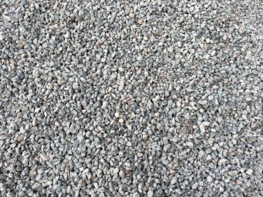 Küçük, ezilmiş bir sürü taş zemin zemin zemin zemininde. Doğal granit çakıl dokusu