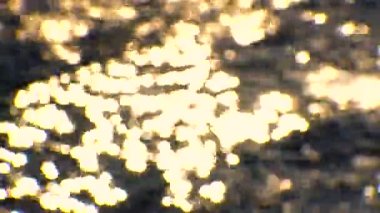 Glare on the water, sun reflection on the water on the sea