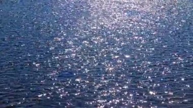 Glare on the water from the sun, in the ocean Ireland