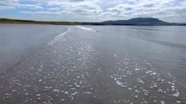 Ocean after low tide sand near the shore