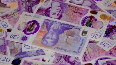 Banknotes English pound, dollar, euro, close-up, on a dark and white background
