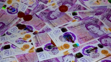Banknotes English pound, dollar, euro, close-up, on a dark and white background