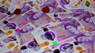 Banknotes English pound, dollar, euro, close-up, on a dark and white background