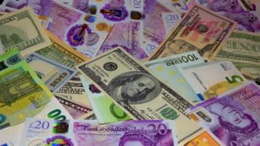 Banknotes English pound, dollar, euro, close-up, on a dark and white background