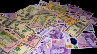 Banknotes English pound, dollar, euro, close-up, on a dark and white background