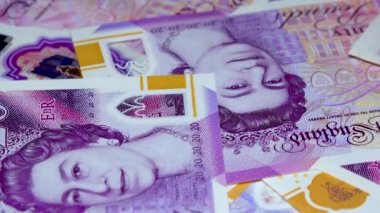 Banknotes English pound, dollar, euro, close-up, on a dark and white background