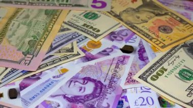 Banknotes English pound, dollar, euro, close-up, on a dark and white background