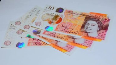 Banknotes English pound, dollar, euro, close-up, on a dark and white background