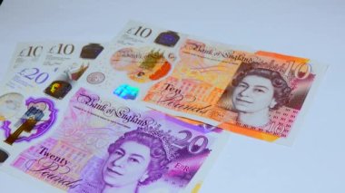 Banknotes English pound, dollar, euro, close-up, on a dark and white background