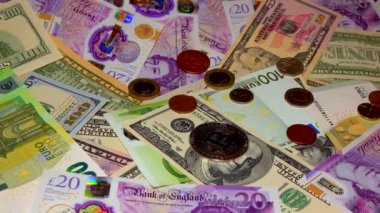 Banknotes English pound, dollar, euro, close-up, on a dark and white background
