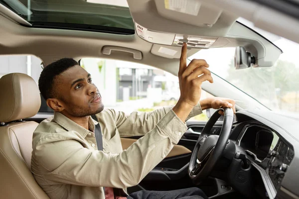 African American Man Sitting Car Pushing Buttons Opening Car Sunroof — Stock Photo, Image