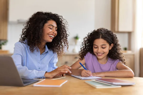 Loving Latin Mother Working Laptop Helping Her Daughter Study Family — Stock Photo, Image