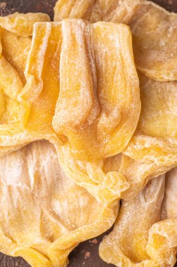 Dried jackfruit chips isolated on white background.