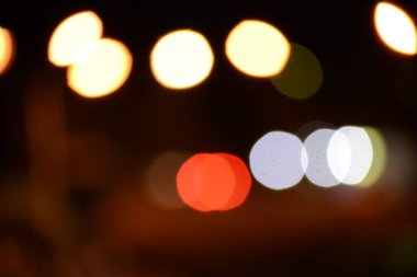 Abstract backgrounds. blur bokeh. Blurry multicolor light from the lamp. Orange is the dominant color