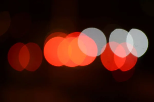 Abstract backgrounds. blur bokeh. Blurry multicolor light from the lamp. Orange is the dominant color