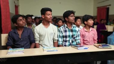 Kaiwara,Chikkaballapura,India-January 5,2017:Point of view on male students listening lesson inside the classroom during class hours