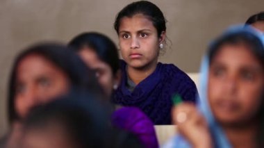 Kaiwara,Chikkaballapura,India-January 5,2017:Closeup fade in, fade out shot of girl students inside the classroom