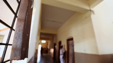Closeup video of an old way of ringing bell inside indian school during class hours