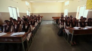 Kaiwara,Chikkaballapura,India-January 5,2017:Wide view of indian female students listening to the lecture in the classroom at rural school of karnataka