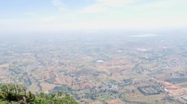 Panoramic view of farmlands and nature from the top of mountain during summer season