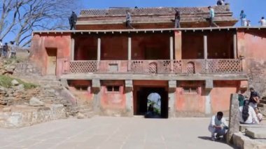 Chikkaballapur,India-january 15,2023:Visitors climbing on top of tipu summer residence or guest house during sunny day