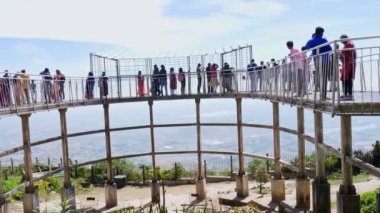 Chikkaballapur,India-january 15,2023:A wide view of people enjoying sight seeing from the watch tower on top of mountain during summer