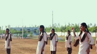 Kaiwara,Chikkaballapura,India-January 5,2017:A closeup of female students playing volleyball on the playground during the evening