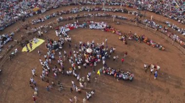 Vijayanagara,India-February 7,2023:An aerial top view of a massive crowd gathered in the fields for a Hindu religious festival.karnikotsava(prophecy),mailaralingeshwara karnika