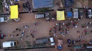 Vijayanagara,India-February 7,2023:Aerial top view of crowds of people on the road returning after a Hindu religious event