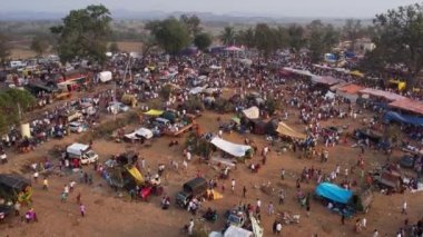 Vijayanagara,India-February 7,2023:Aerial view of farmland with crowds and camping during the hindu religious event karnikotsava or prophecy