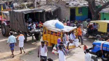 Vijayanagara,India-February 7,2023:A glimpse of crowds of people going to the fair in vehicles during a Hindu religious festival