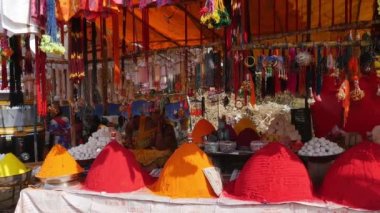 Vijayanagara,India-February 7,2023:Panoramic view of vermilion and turmeric shop with artificial jewelry set up during hindu religious fair