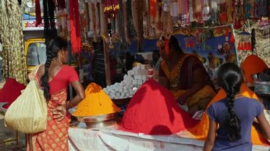 Vijayanagara,India-February 7,2023:A view of vermilion and turmeric shop with artificial jewelry set up during hindu religious fair