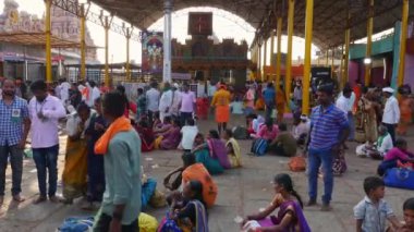 Vijayanagara,India-February 5,2023:A wide view of devotees relaxing outside the temple premises during the hindu religious festival