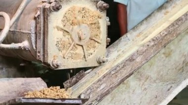 Closeup of a soap plodder machine to refine soap or extrude soap during the process of soap production