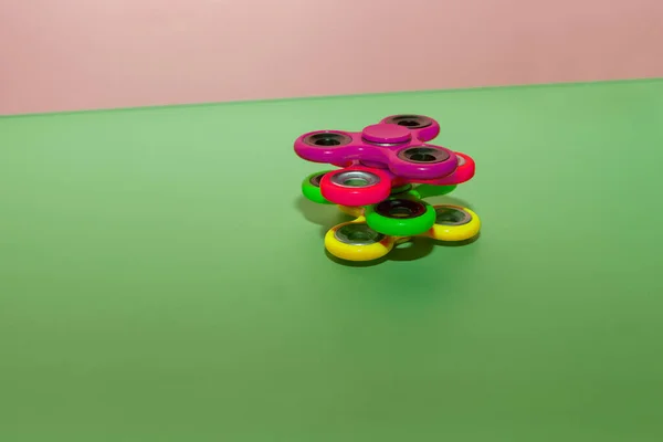 spinner toys balancing. fidget spinner, very popular modern toy for relaxation and stress relief. playing plastic toys