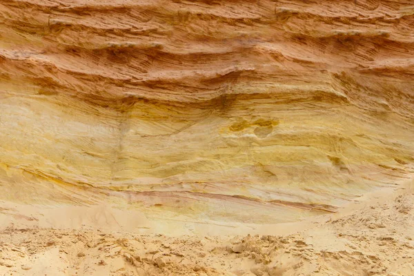 sand layers structure. sedimentary rock-sandstone. Surface of working wall. industrial quarry. opencast mining.