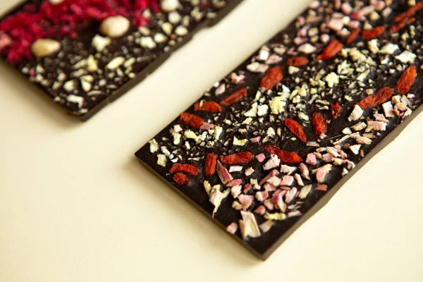 stock image dark chocolate bars surfaces with nuts background from top view. handmade sweet dessert