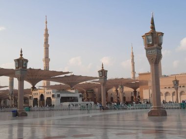Beautiful daytime view of Masjid Al Nabawi, Medina's minarets and mosque courtyard.
