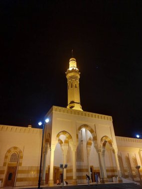 A beautiful night view of the Sayed Al-Shuhada Mosque in Madinah, Saudi Arabia.  The mosque is located in Uhud near the historic Mount of Uhud.