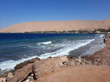 The mesmerizing view of the deep blue waters of Haql beach in Saudi Arabia.