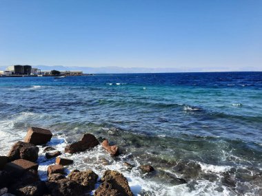 The mesmerizing view of the deep blue waters of Haql beach in Saudi Arabia.