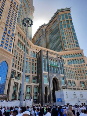 A beautiful daytime view of the Mecca Clock Tower in front of the Grand Mosque in Mecca, Saudi Arabia.