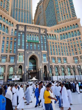 A beautiful daytime view of the Mecca Clock Tower in front of the Grand Mosque in Mecca, Saudi Arabia.