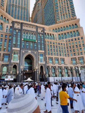 A beautiful daytime view of the Mecca Clock Tower in front of the Grand Mosque in Mecca, Saudi Arabia.