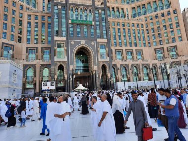 A beautiful daytime view of the Mecca Clock Tower in front of the Grand Mosque in Mecca, Saudi Arabia.
