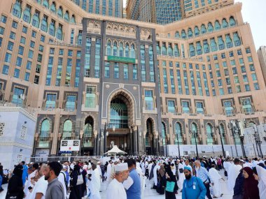 A beautiful daytime view of the Mecca Clock Tower in front of the Grand Mosque in Mecca, Saudi Arabia.