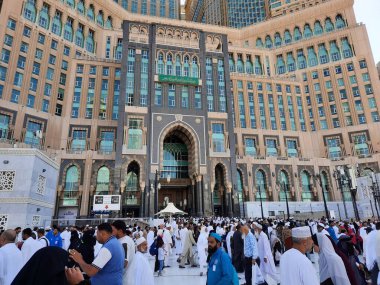 A beautiful daytime view of the Mecca Clock Tower in front of the Grand Mosque in Mecca, Saudi Arabia.