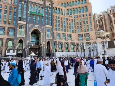 A beautiful daytime view of the Mecca Clock Tower in front of the Grand Mosque in Mecca, Saudi Arabia.